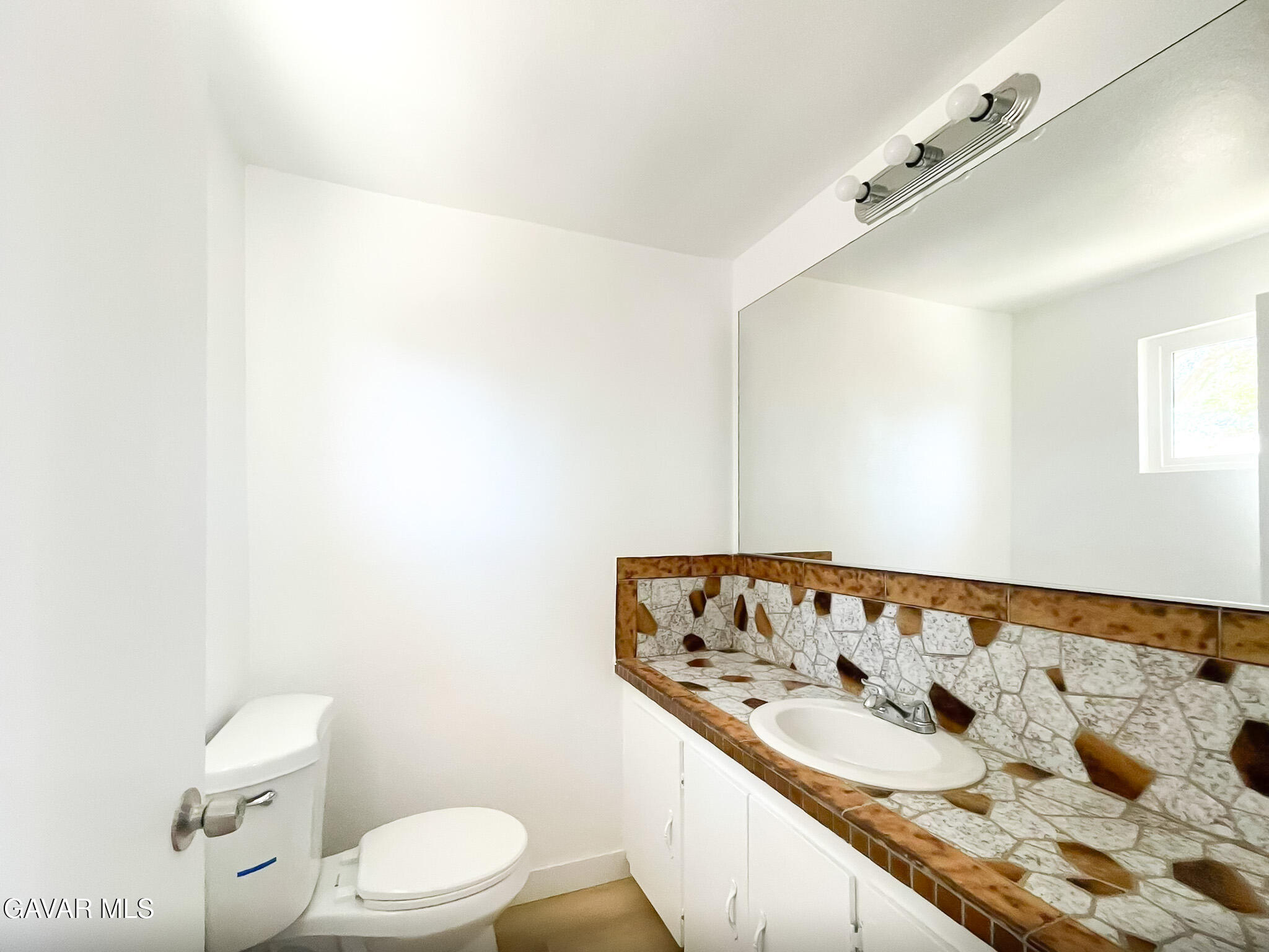 44739 3rd Street East Lancaster, CA 93535 - Photo 20 of 24 a bathroom with a sink and a toilet