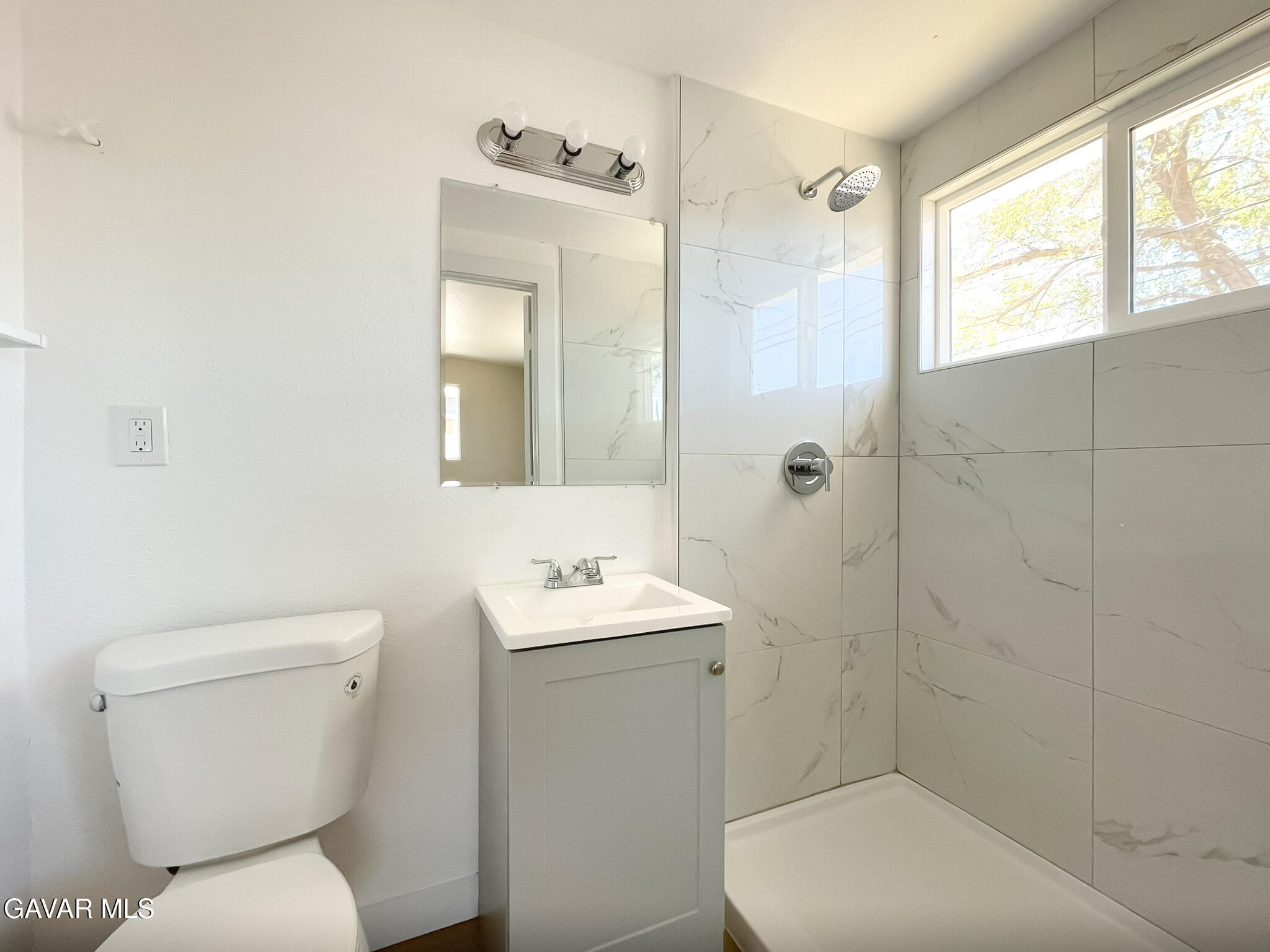 44739 3rd Street East Lancaster, CA 93535 - Photo 24 of 24 a bathroom with a toilet sink and mirror