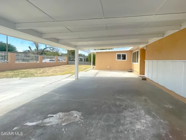 a view of an empty room with a sliding door