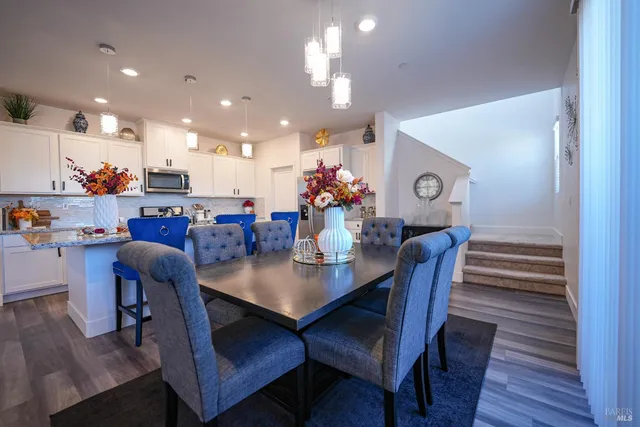 a view of a dining area with furniture and wooden floor
