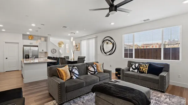 a living room with furniture and a large window