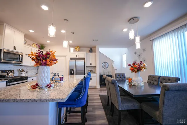 a view of a dining room with furniture and window