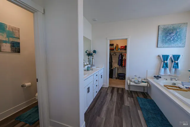 a bathroom with a bathtub and a sink
