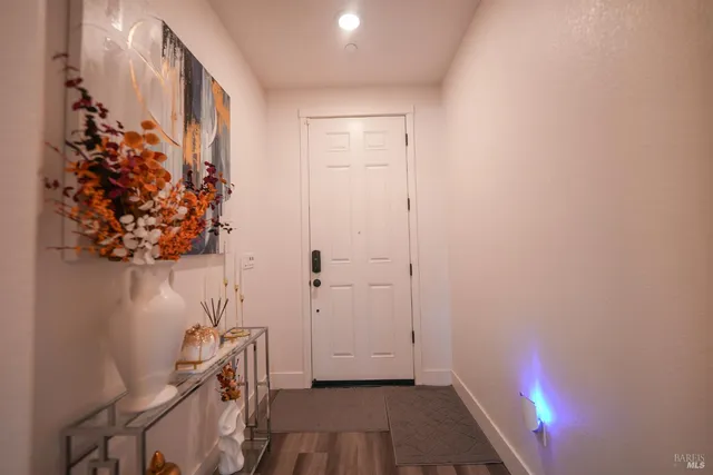 a view of entryway with wooden floor