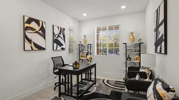 a work room with furniture and a window