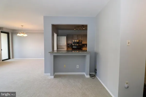 a view of kitchen and hallway