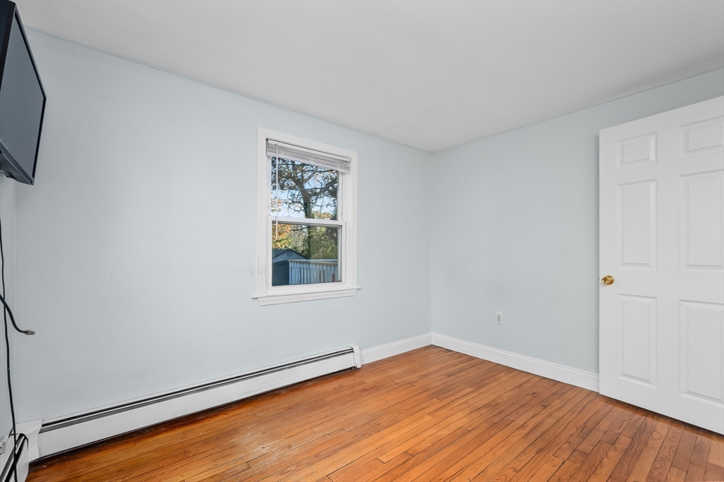 78 Puritan Road Bourne, MA 02532 - Photo 13 of 34 a view of empty room with wooden floor and fan