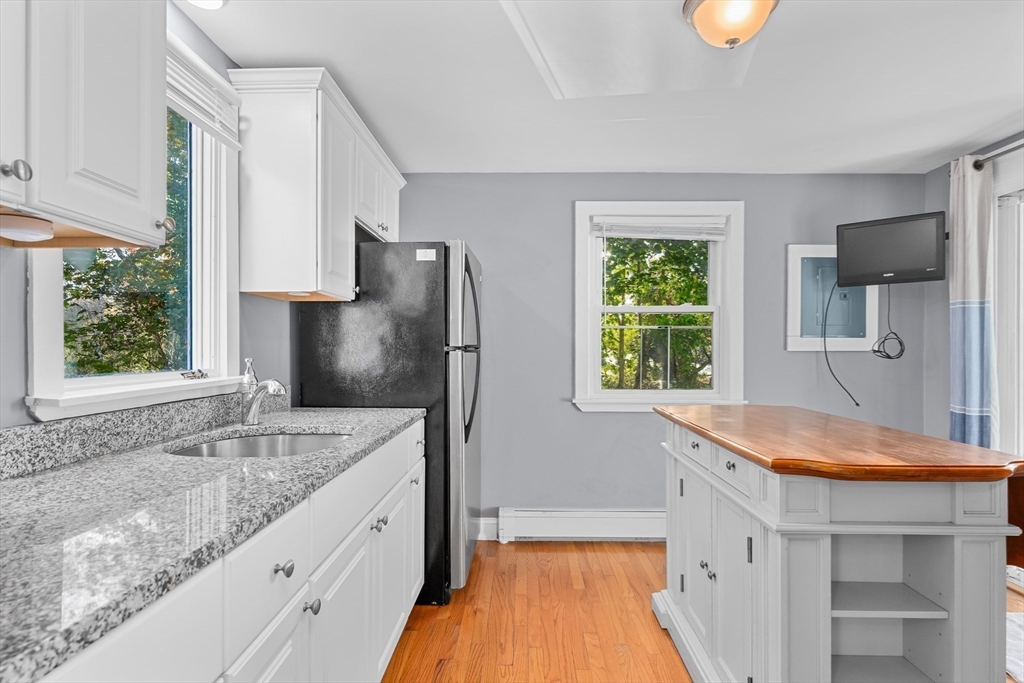 78 Puritan Road Bourne, MA 02532 - Photo 7 of 34 a kitchen with stainless steel appliances granite countertop a sink stove and refrigerator