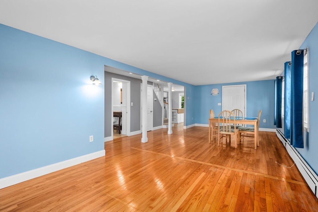 78 Puritan Road Bourne, MA 02532 - Photo 9 of 34 a dining room with granite countertop furniture and wooden floor