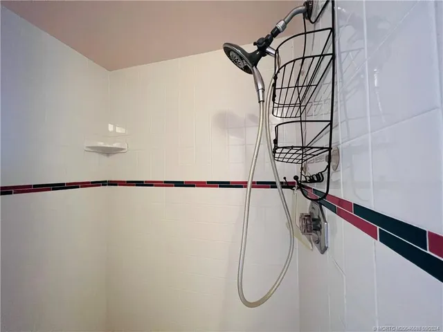 a bathroom with a sink vanity and mirror