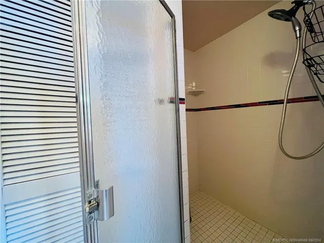 a bedroom with bed and window