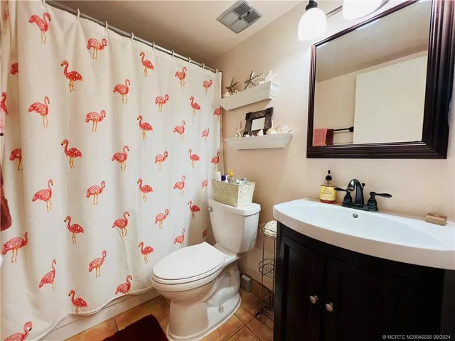 a view of swimming pool with outdoor seating and city view