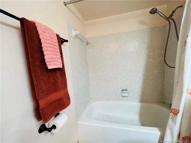 a view of swimming pool with outdoor seating and a buildings