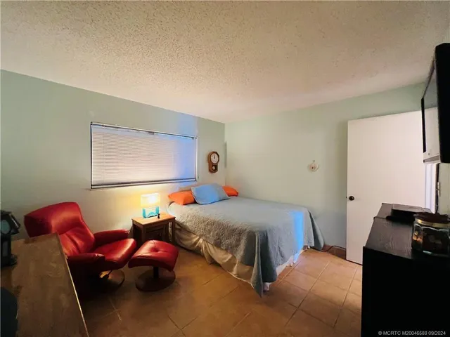 a view of a swimming pool with a patio and yard