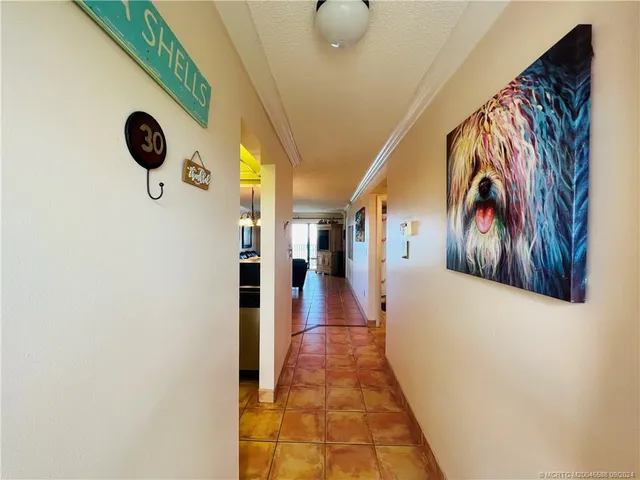 a kitchen with granite countertop a stove a sink and a microwave
