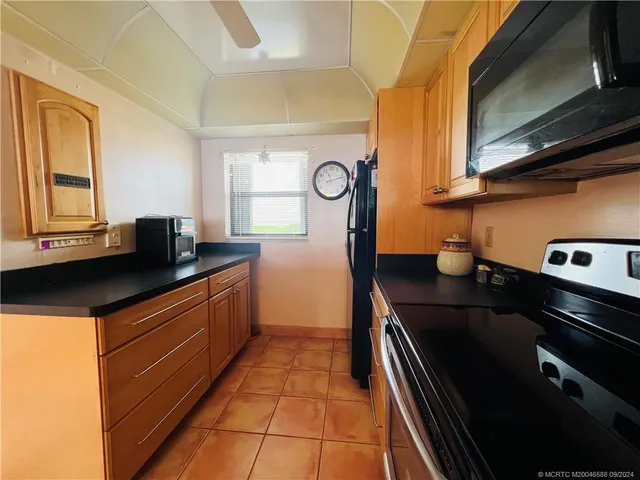 a view of a dining room with furniture and window