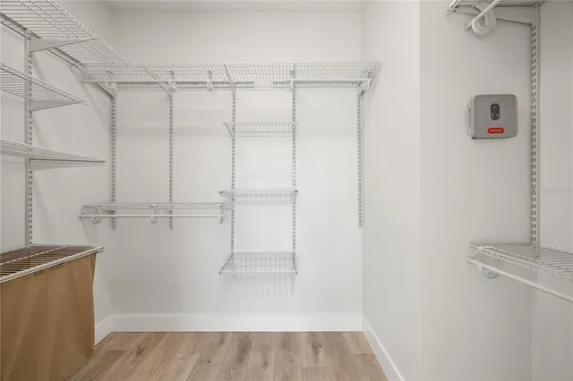 a bathroom with a double vanity sink toilet and shower