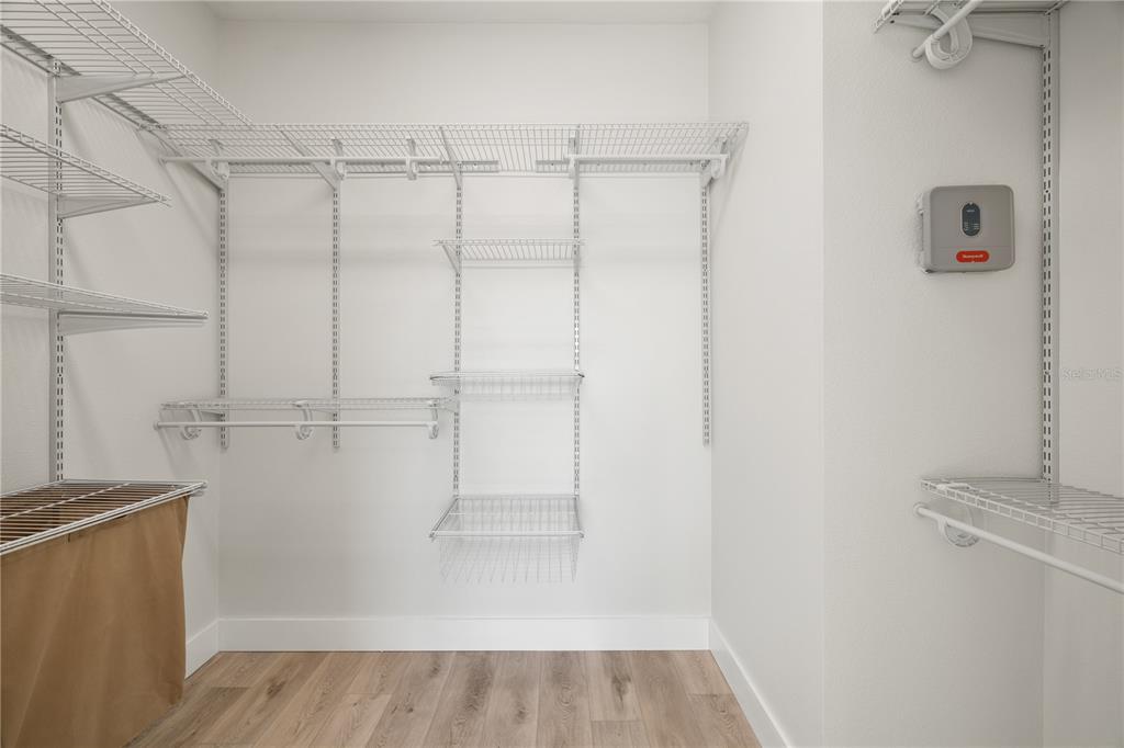 7819 Hardenton Street Windermere, FL 34786 - Photo 40 of 48 a view of walk in closet with empty racks