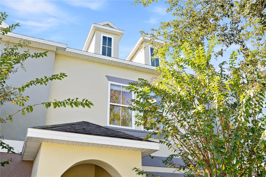 7819 Hardenton Street Windermere, FL 34786 - Photo 4 of 48 a front view of a house with trees