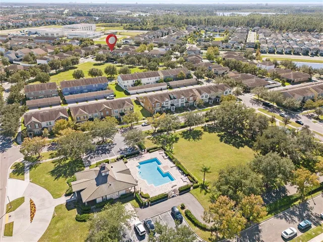 an aerial view of residential houses with outdoor space