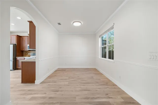 a view of kitchen with furniture and wooden floor