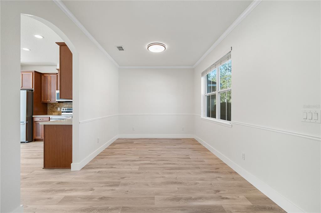 7819 Hardenton Street Windermere, FL 34786 - Photo 9 of 48 a view of kitchen with furniture and wooden floor