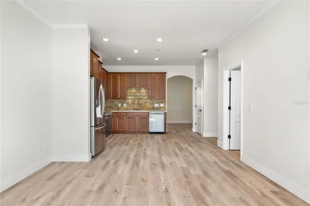 a view of a kitchen with wooden floor