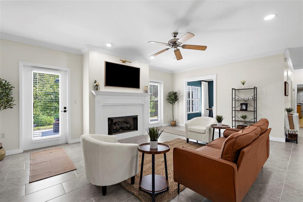 18355 Highway 62 Parrish, FL 34219 - Photo 14 of 50 a living room with furniture a flat screen tv and a fireplace