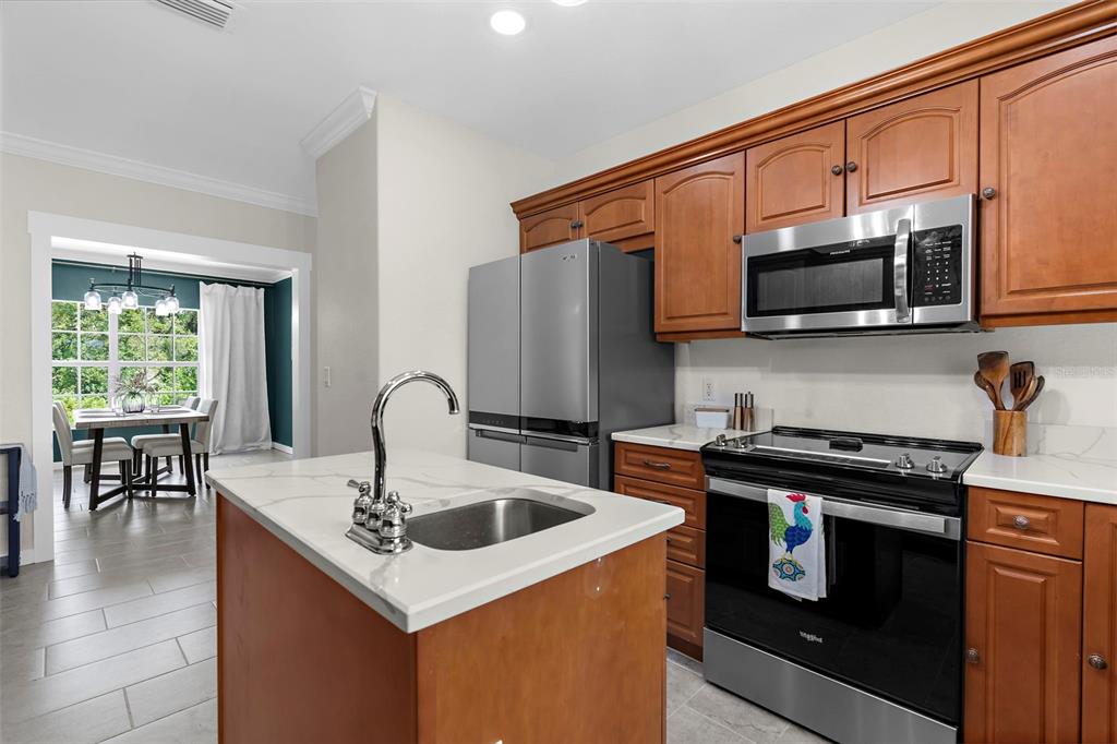 18355 Highway 62 Parrish, FL 34219 - Photo 17 of 50 a kitchen with a stove and a microwave