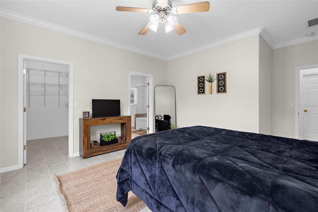 18355 Highway 62 Parrish, FL 34219 - Photo 23 of 50 a bedroom with a bed and a television