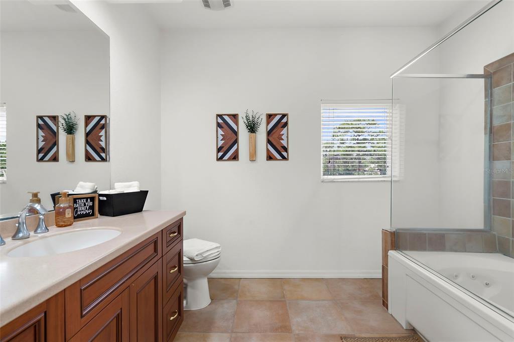 18355 Highway 62 Parrish, FL 34219 - Photo 24 of 50 a bathroom with a sink a toilet and a bathtub