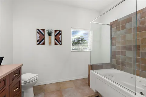 a bathroom with a toilet a sink and bathtub