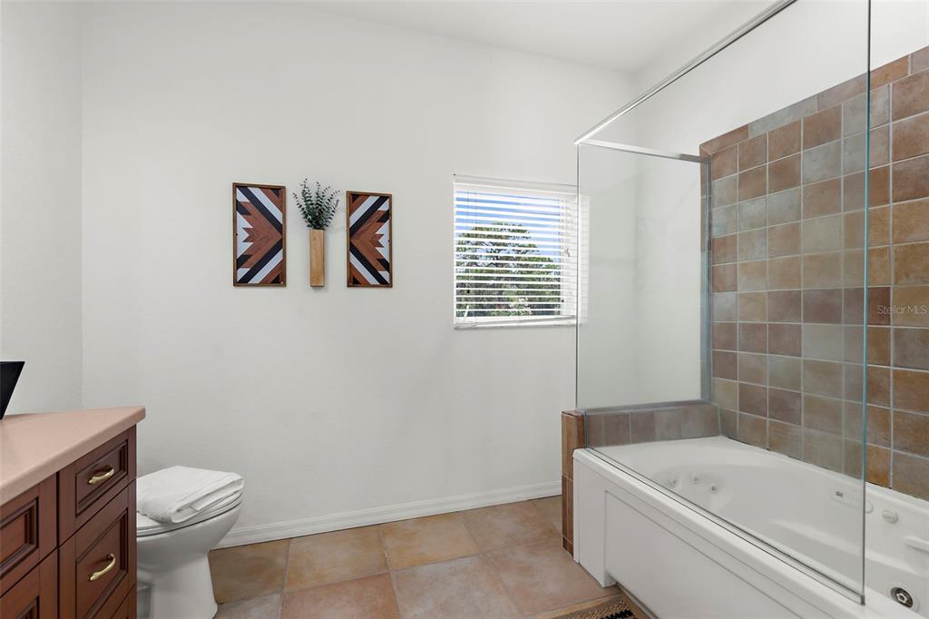 18355 Highway 62 Parrish, FL 34219 - Photo 26 of 50 a bathroom with a toilet a sink and bathtub