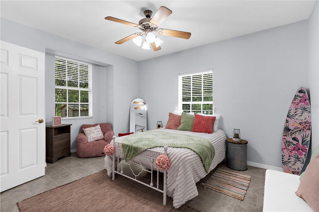 18355 Highway 62 Parrish, FL 34219 - Photo 28 of 50 a bedroom with a bed couch and a window