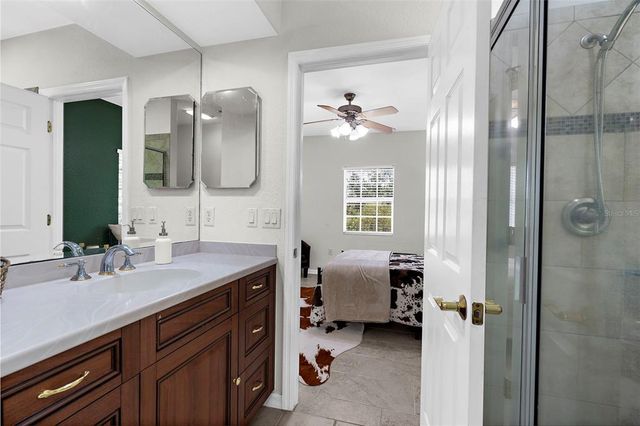 a en suite bathroom with a double vanity sink double and a mirror