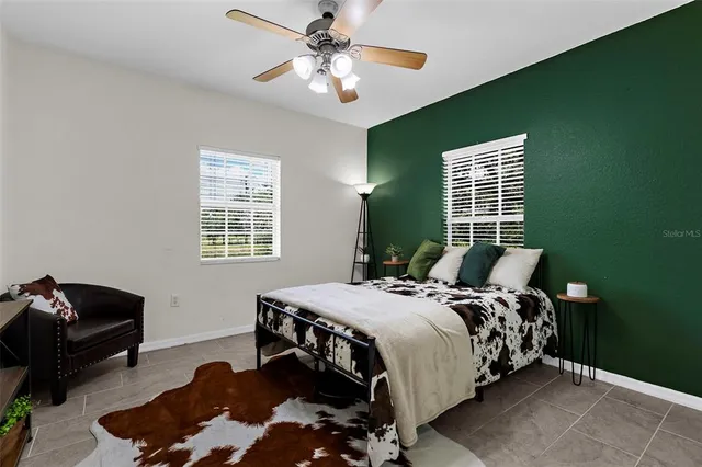 a bedroom with bed and a window