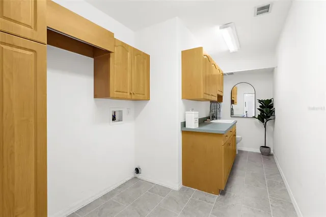 a view of a bathroom with a sink and a mirror