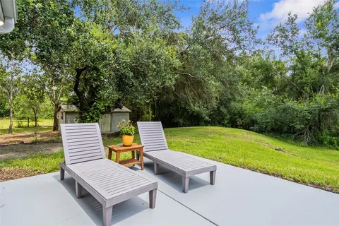 a view of a park with lounge chair