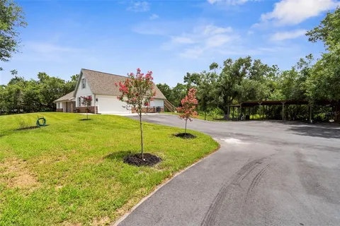 a backyard of a house with lots of green space