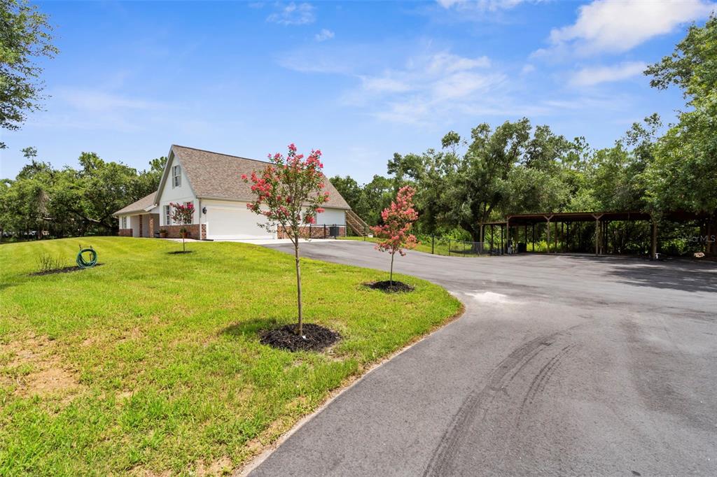 18355 Highway 62 Parrish, FL 34219 - Photo 4 of 50 a backyard of a house with lots of green space