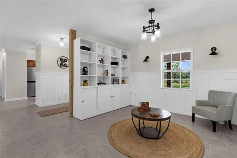 a living room with furniture and window