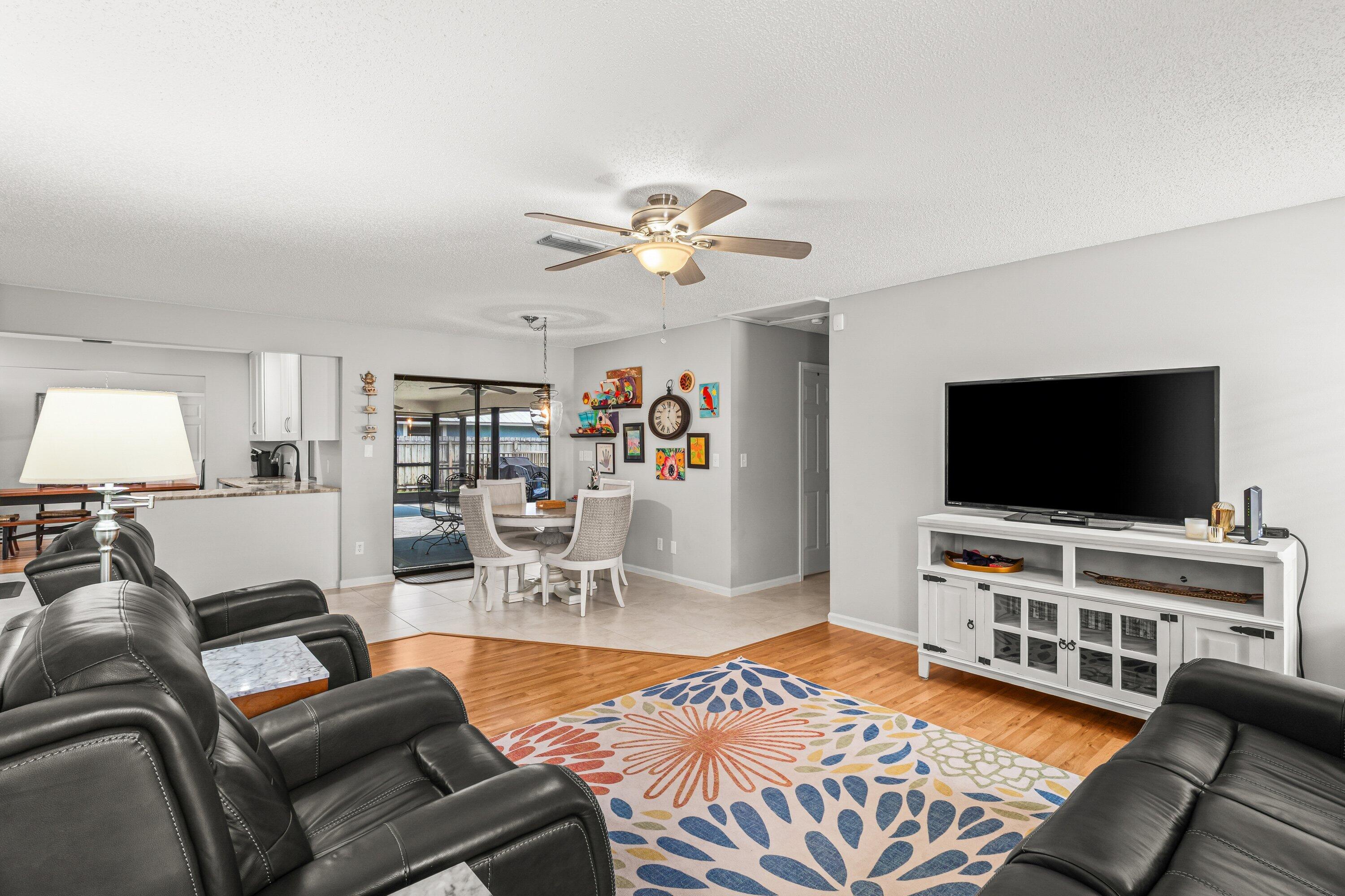 13795 Geranium Place Wellington, FL 33414 - Photo 12 of 37 a living room with furniture and a flat screen tv