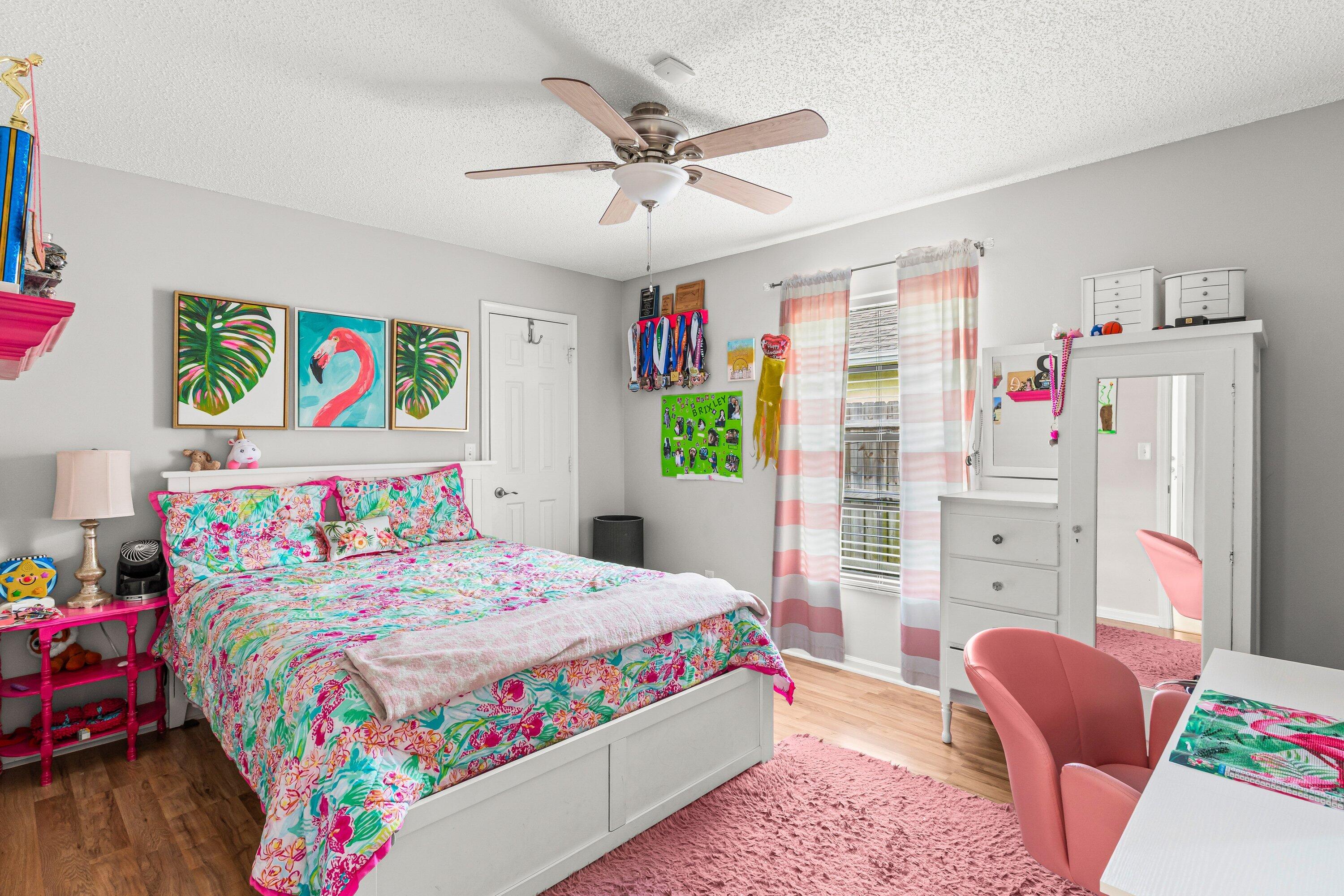 13795 Geranium Place Wellington, FL 33414 - Photo 17 of 37 a bedroom with a bed dresser and window