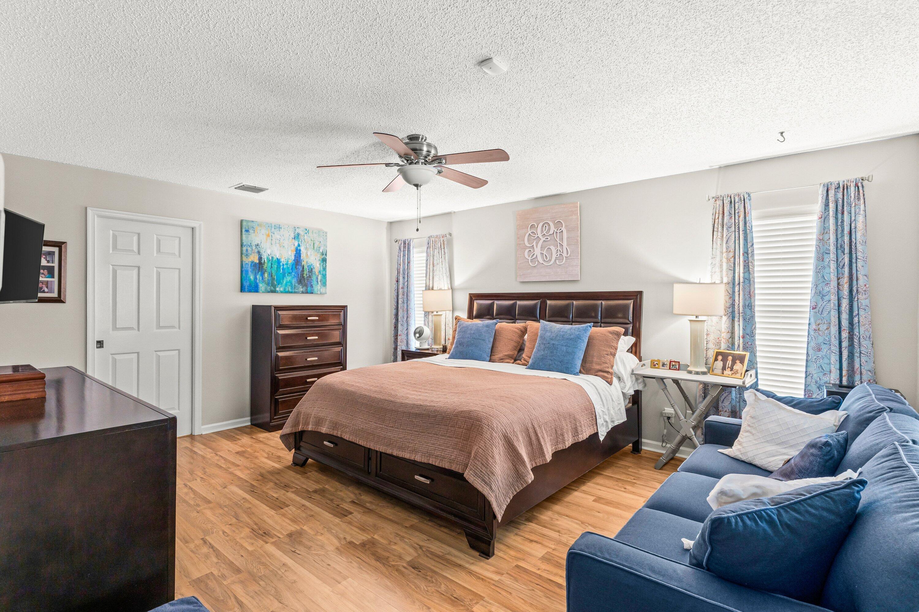 13795 Geranium Place Wellington, FL 33414 - Photo 18 of 37 a spacious bedroom with a bed and window