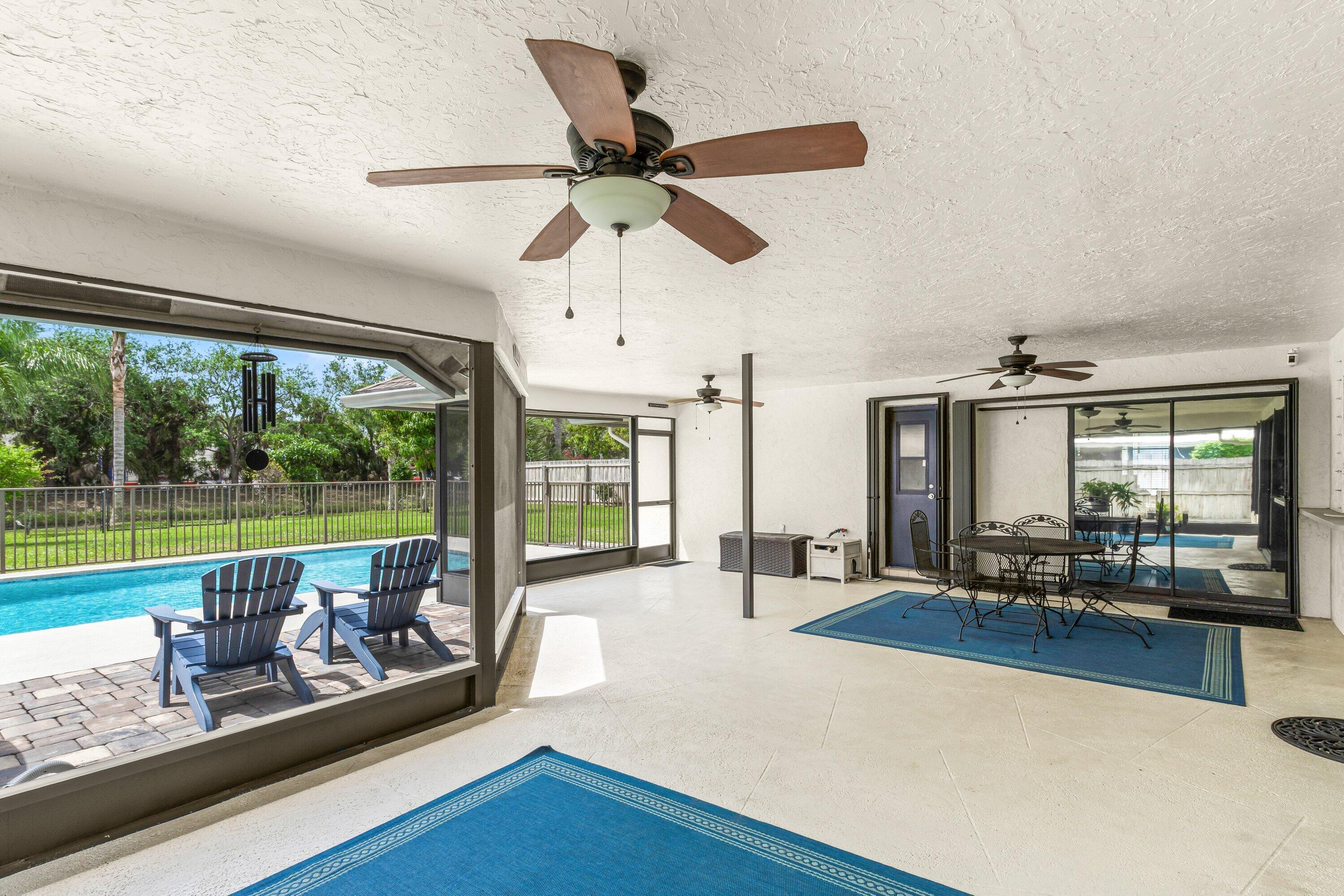 13795 Geranium Place Wellington, FL 33414 - Photo 23 of 37 a living room with furniture and a large window