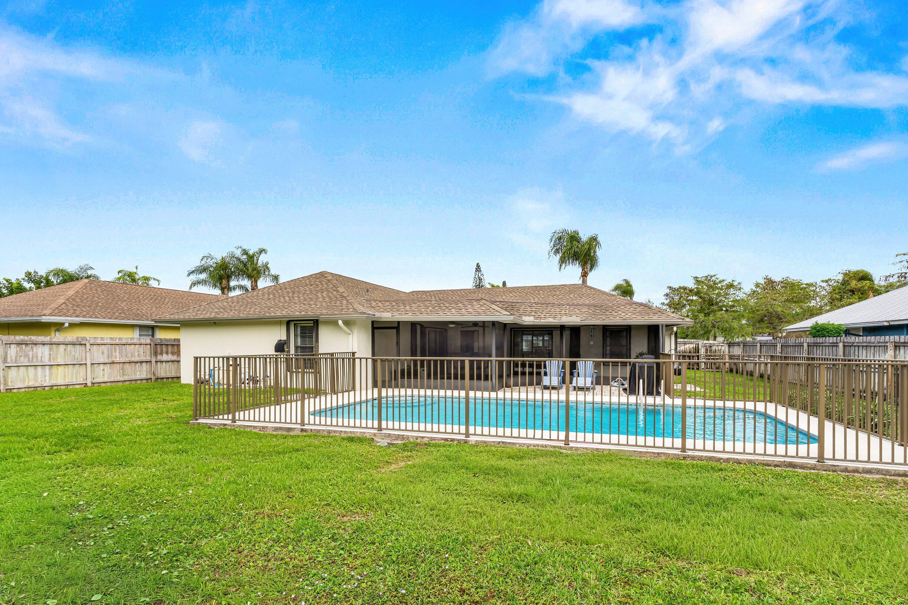 13795 Geranium Place Wellington, FL 33414 - Photo 27 of 37 a view of a house with a backyard
