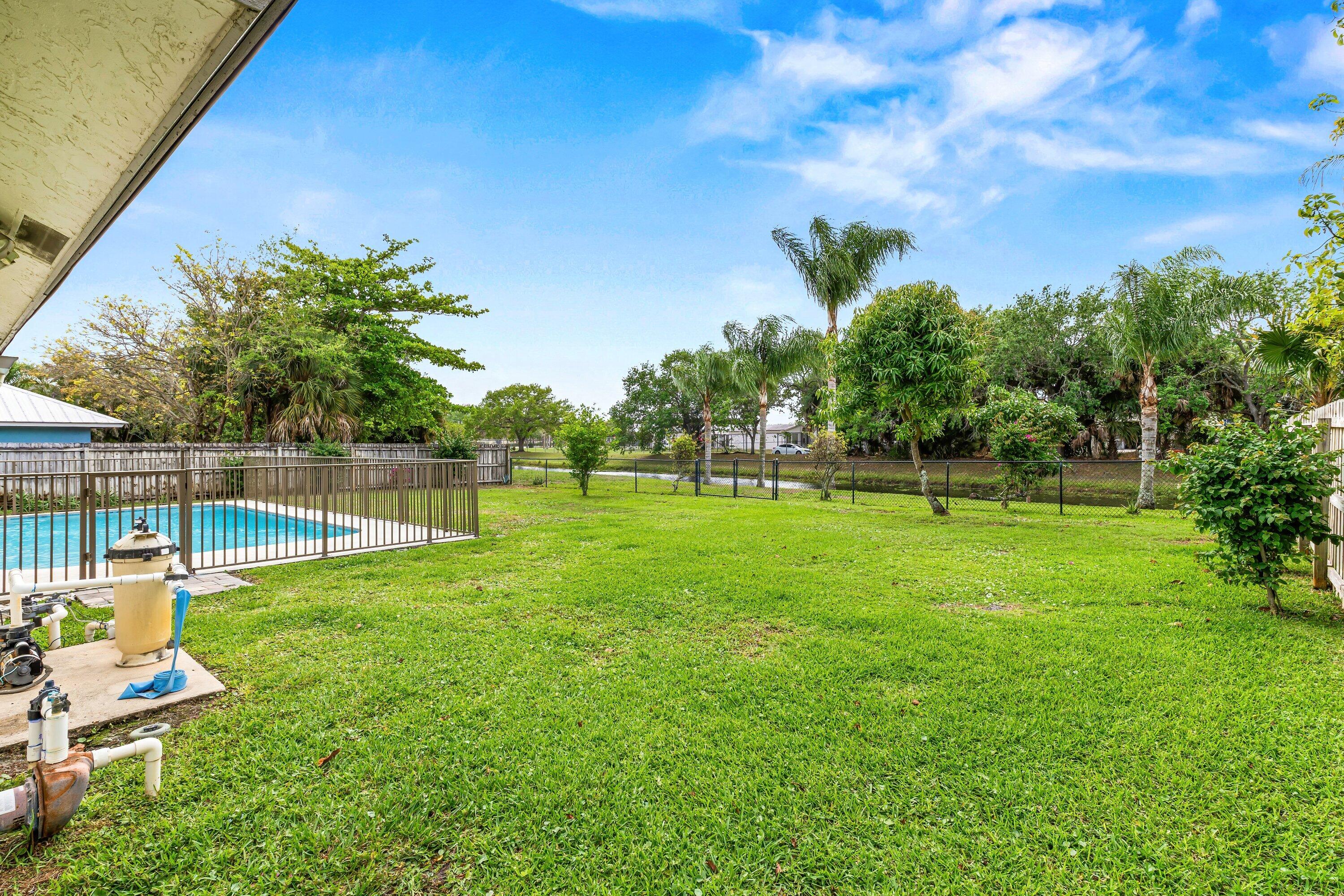 13795 Geranium Place Wellington, FL 33414 - Photo 29 of 37 a view of a garden with a slide