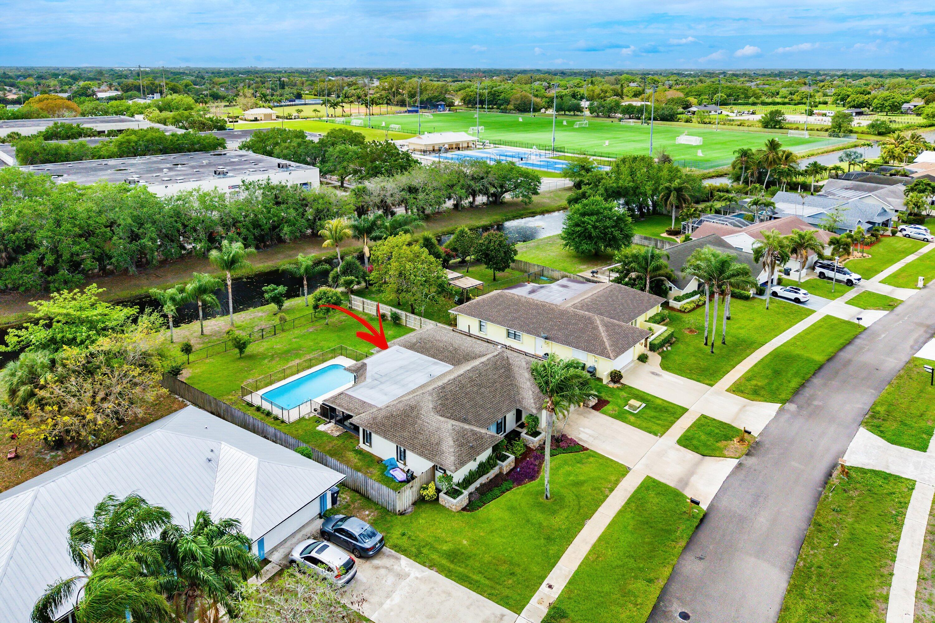 13795 Geranium Place Wellington, FL 33414 - Photo 35 of 37 a view of yard with outdoor seating