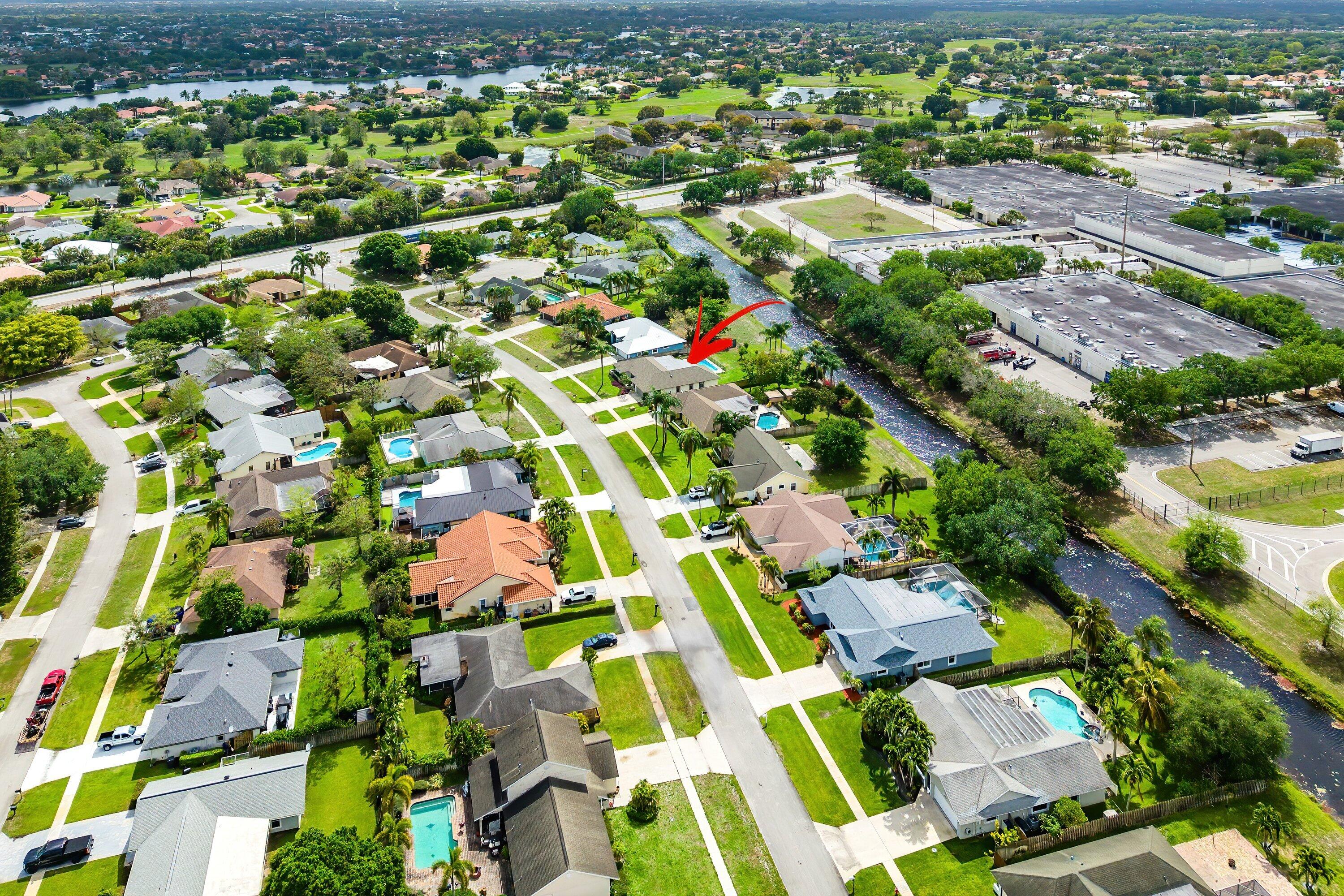 13795 Geranium Place Wellington, FL 33414 - Photo 37 of 37 an aerial view of residential houses with outdoor space