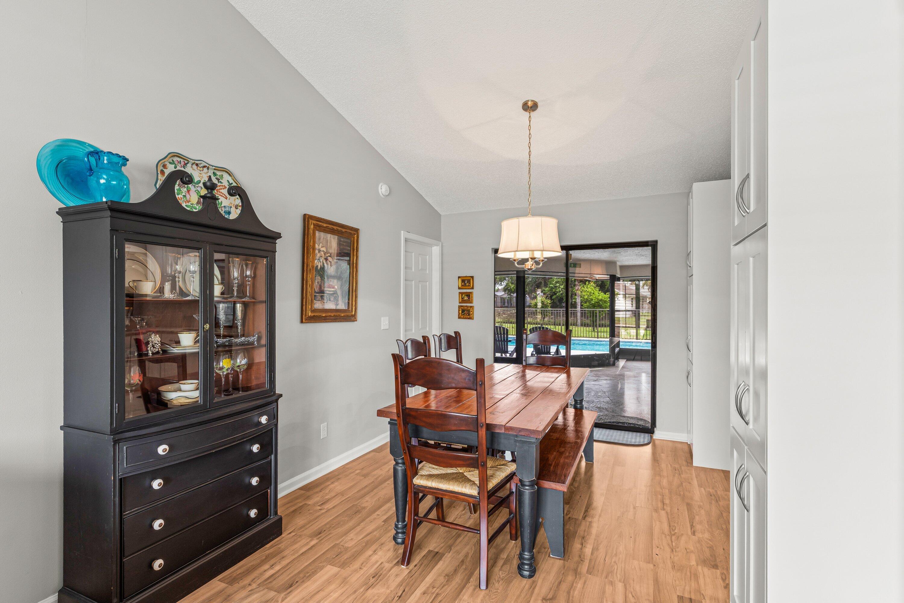 13795 Geranium Place Wellington, FL 33414 - Photo 10 of 37 a view of a dining room with furniture window and wooden floor